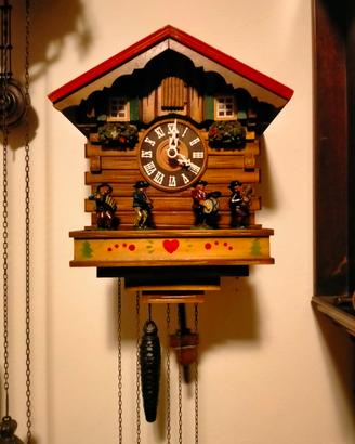 orologio a cucù con musicisti 