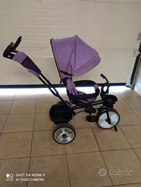 triciclo con guida materna .