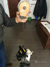 Elettrocucitrice portatile per  cucitura di sacc