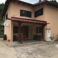 Casa bifamiliare con terreno e box