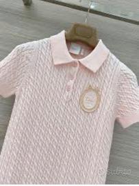 Polo rosa in maglia.