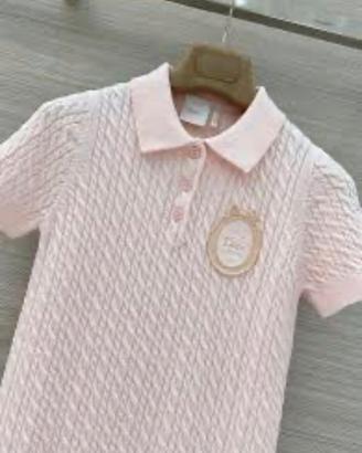 Polo rosa in maglia.