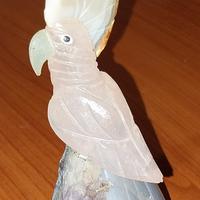 coppia  pappagalli in pietra