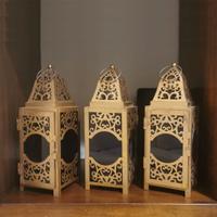 Tris di lanterne dorate in metallo