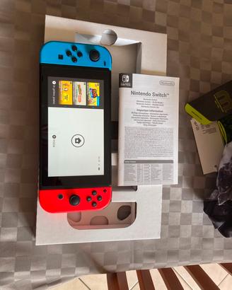 nintendo switch kit completo più 2 giochi