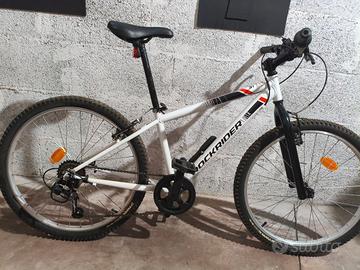 MTB bambino ROCKRIDER ST 100 24” + rotelle + casco