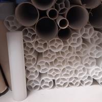 Tubi in plastica e cartone pressato
