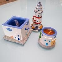 Set 2 candele + statuetta a forma di faro