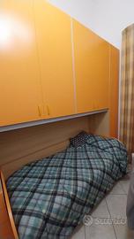 cameretta con armadio a ponte e doppio letto