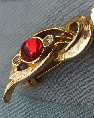 Spilla anni '80 in metallo dorato