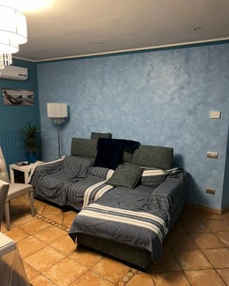 Divano tre posti con penisola