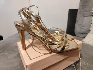 Scarpe oro shop alla schiava