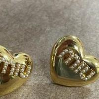 Orecchini d'amore dorati Miu Miu