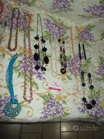 7collan(E3,50cad)+1complet(E3,5):collan e braccial