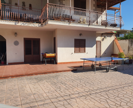 Casa con giardino