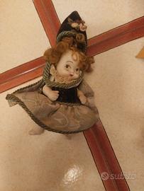 piccola bambola in porcellana 