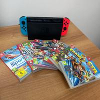 Console Nintendo Switch con scatola e giochi