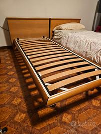 2 Letti singoli con testata contenitore