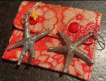 Orecchini con stella marina vera in bagno argento