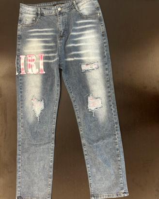 Jeans AMIRI distressed con patch plaid rosa