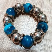 Bracciale regolabile con perle azzurre e argento