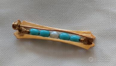 Spilla anni '70 in oro giallo 18K