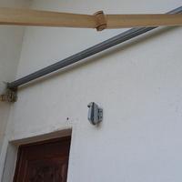 Struttura per tende a bracci arretrabili in allumi