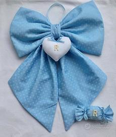 Fiocchi nascita e torte di pannolini