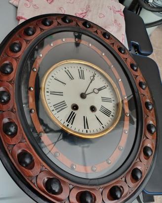 Orologio antico a pendolo occhio di bue
