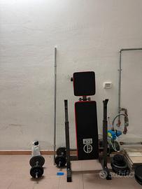 Panca  con pesi ,bilanciere, manubri