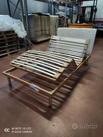 Letto con testiera in tessuto