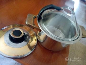 Tre pentole la più grande con due coperchi come si