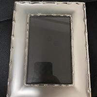 Cornice in argento