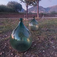 2 damigiane  grandi in vetro verde