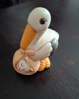 Thun cicogna con gattino nel fagotto 