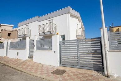 Nuova villa bifamiliare con ampio giardino