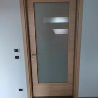 1 porta a battente DORIGO linea Pegaso con vetro