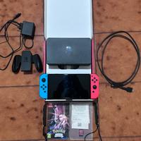 Nintendo switch Oled 64gb - rosso/blu - 2 giochi