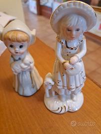 Statuine in ceramica e in porcellana