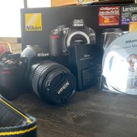 Nikon D3100 + Obiettivo Af-S Dx 18-55 VR tracolla