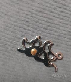 ciondoli in acciaio con inserti in oro 