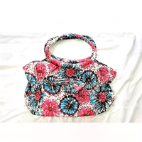 Borsa a spalla con una vivace stampa floreale. Un
