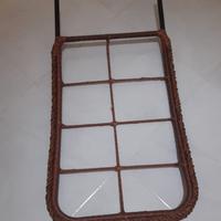 dondolo con cuscini e poggiapiedi in rattan