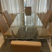 Tavolo in cristallo con piede in ferro battuto