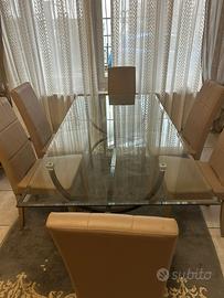 Tavolo in cristallo con piede in ferro battuto