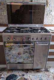 Cucina libera Smeg acciaio inox 5 fuochi forno