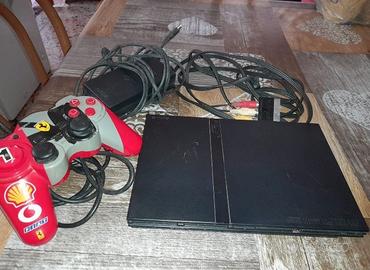 playstation 2 slim con joystick ferrari