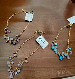 stock collane chiusura attività+3 espositori omagg