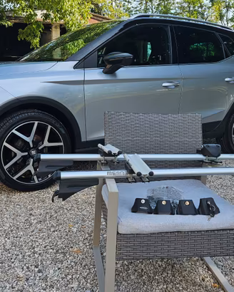 Barre portatutto Menabo e 2 kit porta bici peruzzo