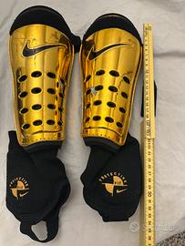 Parastinchi nike colore oro